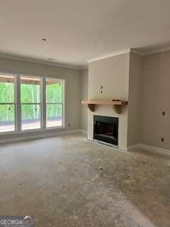 816 Proctor Rd, Rockmart, GA 30153 - unfurnished living room with crown molding, baseboards, and a fireplace
