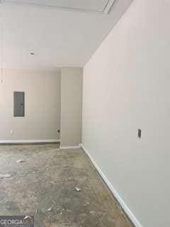 816 Proctor Rd, Rockmart, GA 30153 - spare room featuring baseboards and electric panel