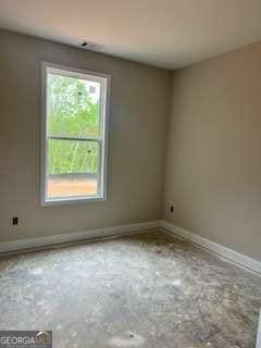 816 Proctor Rd, Rockmart, GA 30153 - spare room with concrete flooring and baseboards