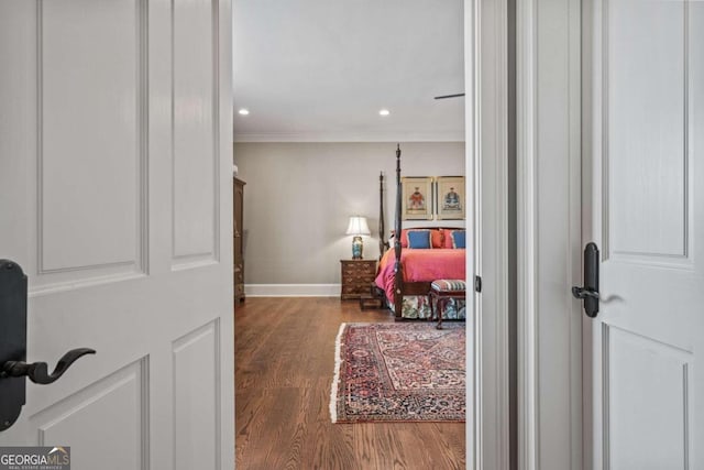 entrance foyer with ornamental molding, recessed lighting, wood finished floors, and baseboards