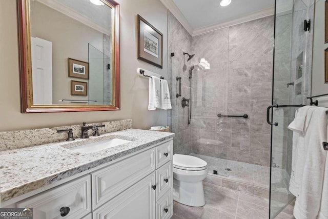 full bathroom with ornamental molding, a shower stall, toilet, and vanity