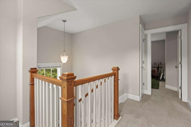 2995 Boulder Walk Ct SE, Atlanta, GA 30316 - hallway featuring an upstairs landing, vaulted ceiling, light carpet, and baseboards