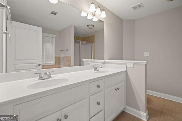 2995 Boulder Walk Ct SE, Atlanta, GA 30316 - full bath with tile patterned flooring, double vanity, a shower stall, and baseboards