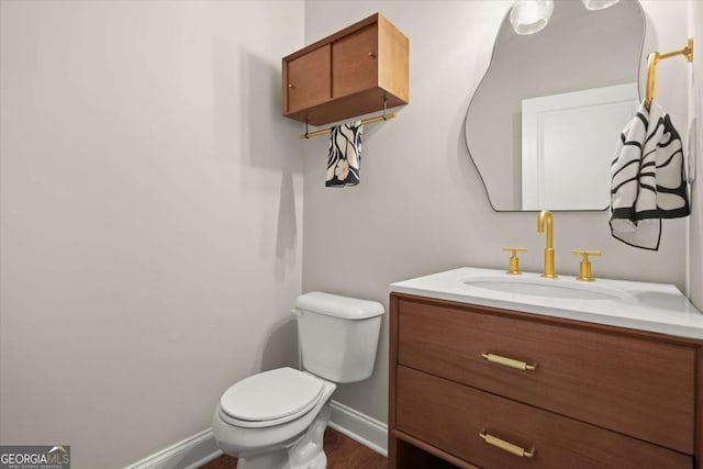 2995 Boulder Walk Ct SE, Atlanta, GA 30316 - half bath with toilet, vanity, baseboards, and wood finished floors