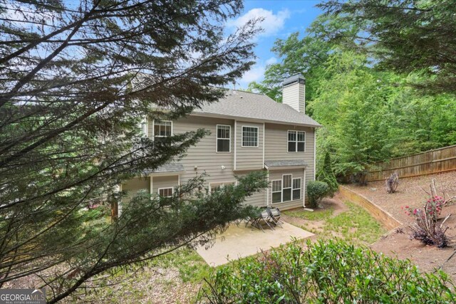 2995 Boulder Walk Ct SE, Atlanta, GA 30316 - rear view of property featuring a chimney, a patio area, and fence