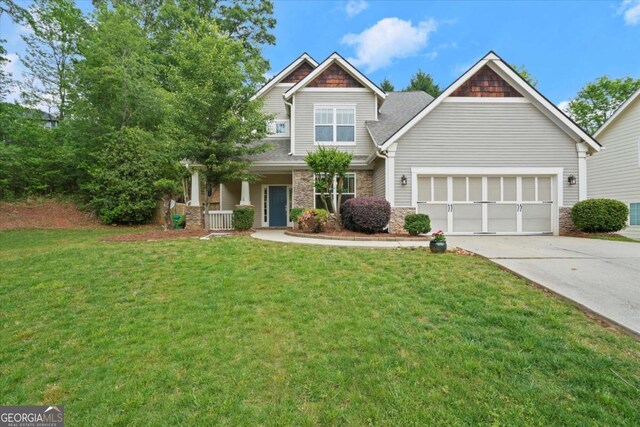 2995 Boulder Walk Ct SE, Atlanta, GA 30316 - craftsman inspired home with driveway, a front yard, stone siding, and a garage