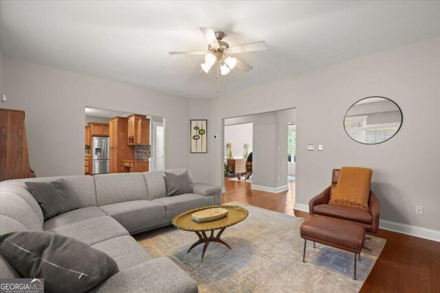 2995 Boulder Walk Ct SE, Atlanta, GA 30316 - living room featuring ceiling fan, dark wood-type flooring, and baseboards