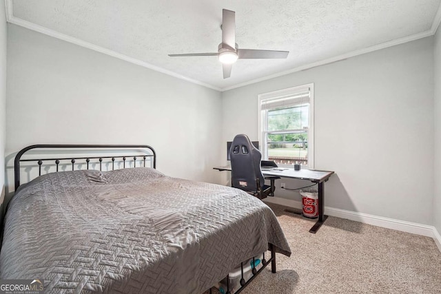 carpeted bedroom featuring crown molding, a ceiling fan, and baseboards