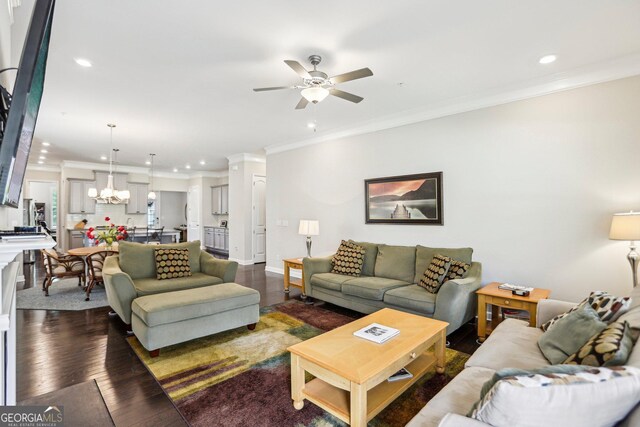 175 Campaign Trl, Fayetteville, GA 30214 - living room with ornamental molding, recessed lighting, dark wood finished floors, and ceiling fan with notable chandelier