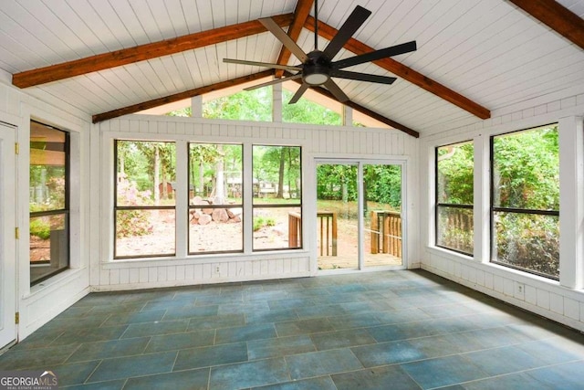 unfurnished sunroom featuring lofted ceiling with beams, ceiling fan, and a wealth of natural light