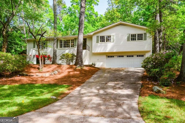 view of front of property featuring brick siding, concrete driveway, and an attached garage