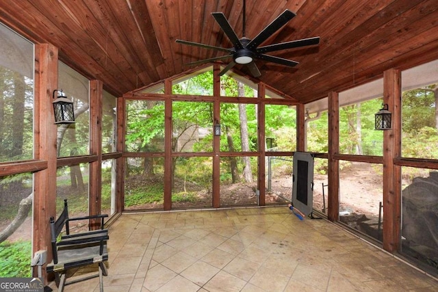 unfurnished sunroom with a ceiling fan