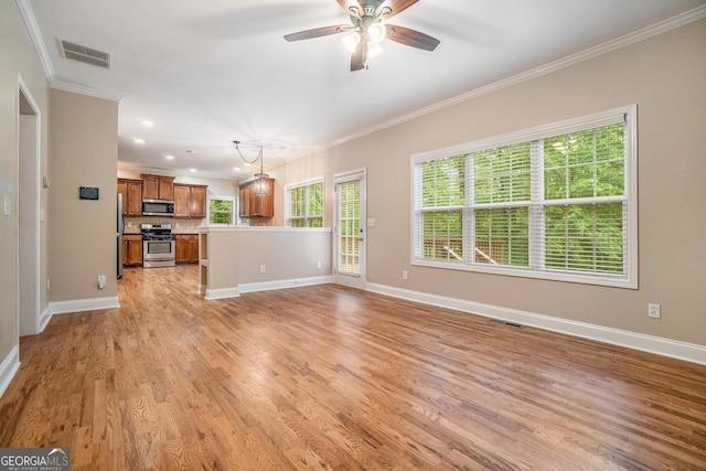 71 Anita Pl SE, Mableton, GA 30126 - unfurnished living room with crown molding, a ceiling fan, healthy amount of natural light, light wood-style flooring, and recessed lighting