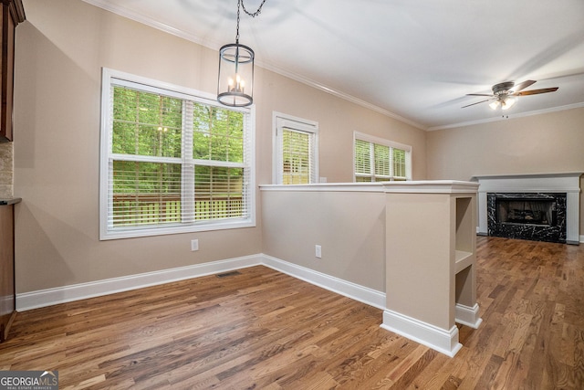 71 Anita Pl SE, Mableton, GA 30126 - unfurnished dining area featuring ornamental molding, ceiling fan, wood finished floors, and a high end fireplace