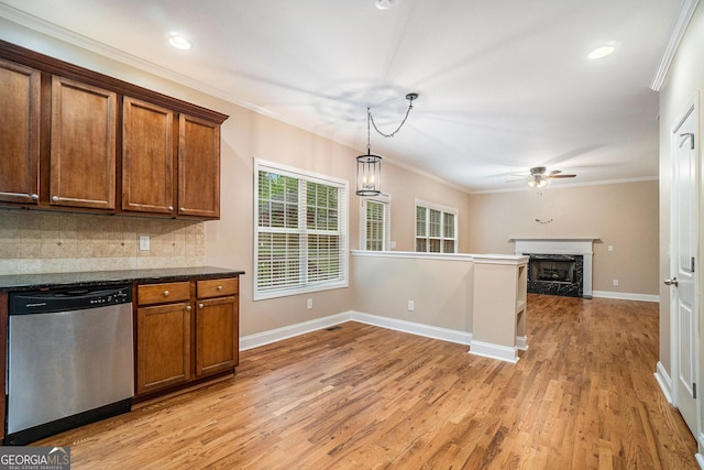 71 Anita Pl SE, Mableton, GA 30126 - kitchen with dishwasher, a ceiling fan, light wood finished floors, decorative backsplash, and brown cabinets