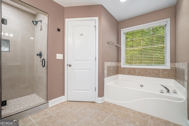 71 Anita Pl SE, Mableton, GA 30126 - bathroom with a shower stall, a garden tub, and tile patterned floors