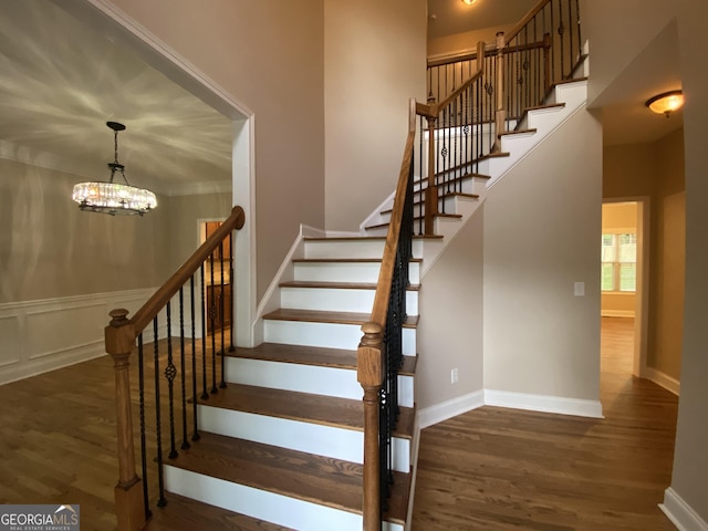 71 Anita Pl SE, Mableton, GA 30126 - stairway featuring a chandelier and wood finished floors