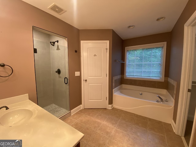 71 Anita Pl SE, Mableton, GA 30126 - full bath featuring a shower stall, a garden tub, vanity, tile patterned floors, and recessed lighting