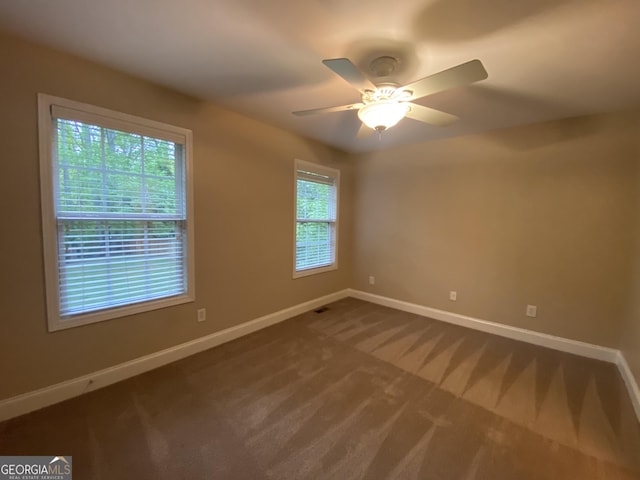 71 Anita Pl SE, Mableton, GA 30126 - empty room featuring dark carpet and ceiling fan