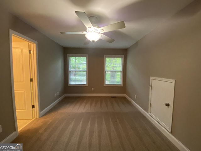 71 Anita Pl SE, Mableton, GA 30126 - empty room with carpet flooring and a ceiling fan
