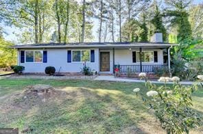 1824 Guardian Way, Lawrenceville, GA 30043 - single story home featuring a front yard, covered porch, and a chimney