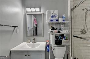 1824 Guardian Way, Lawrenceville, GA 30043 - bathroom featuring a tile shower, toilet, and vanity