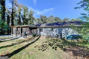 1824 Guardian Way, Lawrenceville, GA 30043 - back of house featuring an attached carport