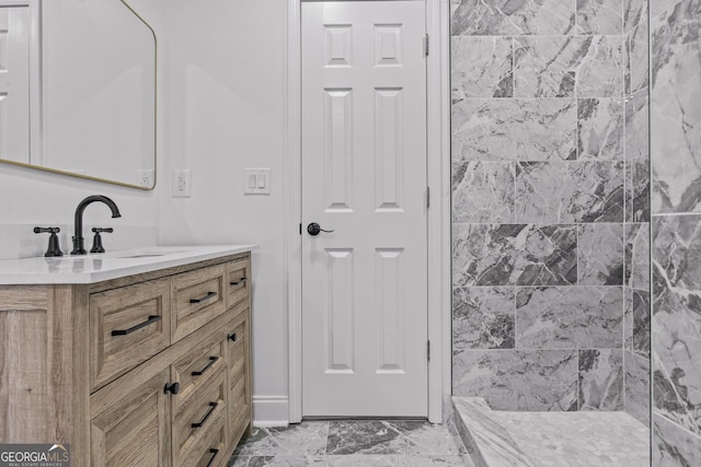 bathroom featuring vanity and marble finish floor