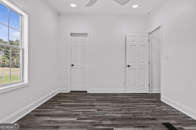 interior space featuring visible vents, recessed lighting, dark wood-type flooring, and baseboards