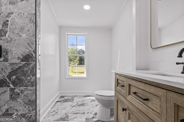 bathroom featuring baseboards, ornamental molding, toilet, and marble finish floor