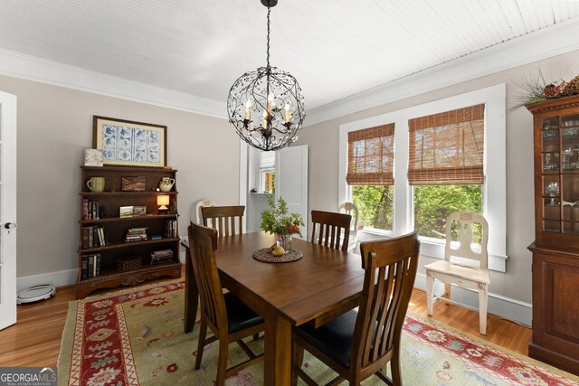 19 Oak Creek Cir, Toccoa, GA 30577 - dining space with light wood-style floors, crown molding, a notable chandelier, and baseboards