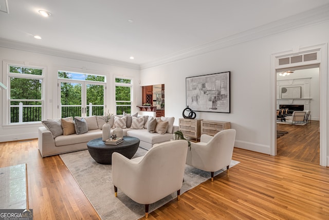 8345 Jett Ferry Rd, Sandy Springs, GA 30350 - living area featuring ornamental molding, wood finished floors, a fireplace, and recessed lighting