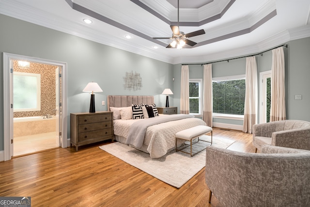 8345 Jett Ferry Rd, Sandy Springs, GA 30350 - bedroom with crown molding, a tray ceiling, light wood-type flooring, recessed lighting, and ensuite bath