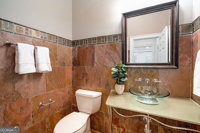 8345 Jett Ferry Rd, Sandy Springs, GA 30350 - bathroom featuring tile walls and vanity