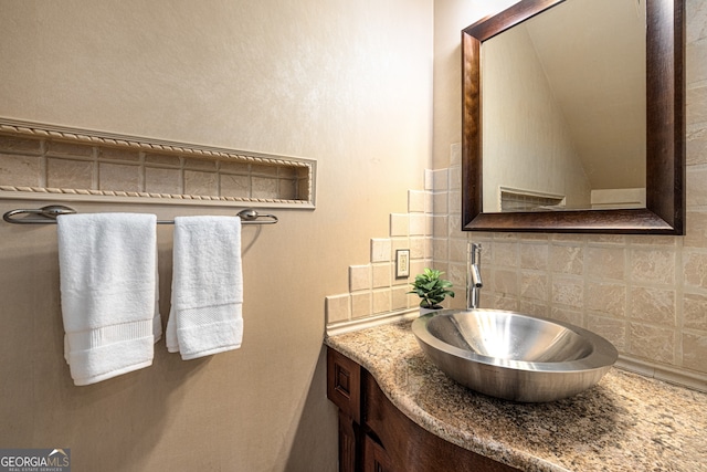 8345 Jett Ferry Rd, Sandy Springs, GA 30350 - bathroom with vanity and tasteful backsplash