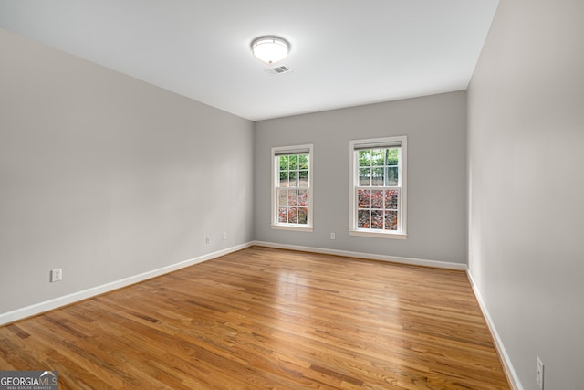 8345 Jett Ferry Rd, Sandy Springs, GA 30350 - spare room with baseboards and light wood-style floors