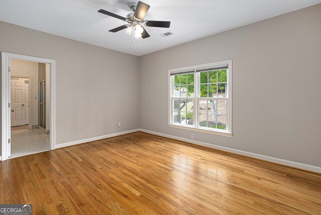 8345 Jett Ferry Rd, Sandy Springs, GA 30350 - spare room with light wood-style floors and a ceiling fan