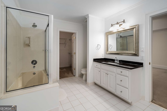 8345 Jett Ferry Rd, Sandy Springs, GA 30350 - full bath featuring vanity, ornamental molding, tile patterned flooring, a spacious closet, and shower / bath combination with glass door