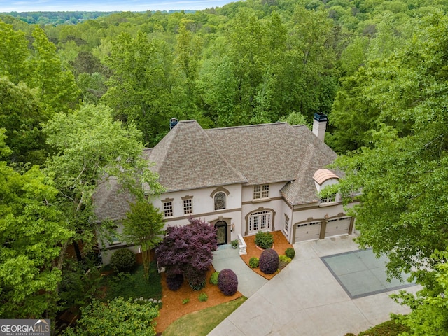 8345 Jett Ferry Rd, Sandy Springs, GA 30350 - view of subject property featuring a heavily wooded area