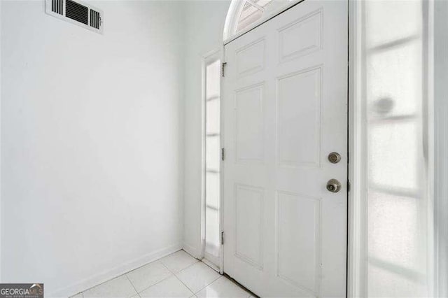 3420 Honeysuckle Ln, Lithia Springs, GA 30122 - entrance foyer with light tile patterned floors, visible vents, and baseboards