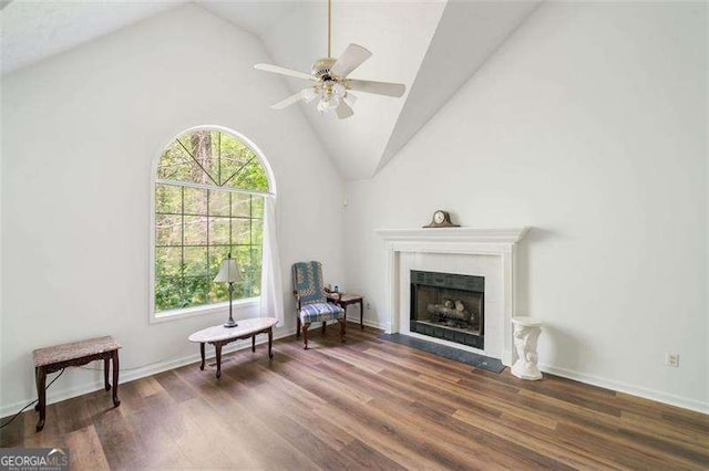 3420 Honeysuckle Ln, Lithia Springs, GA 30122 - living area featuring wood finished floors, ceiling fan, a fireplace, baseboards, and high vaulted ceiling