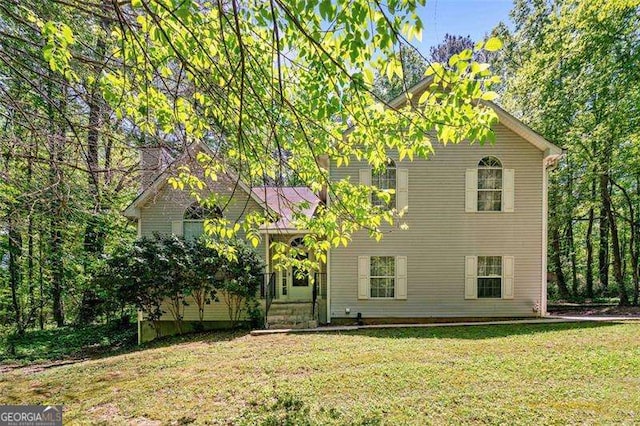 3420 Honeysuckle Ln, Lithia Springs, GA 30122 - view of front facade featuring a front lawn