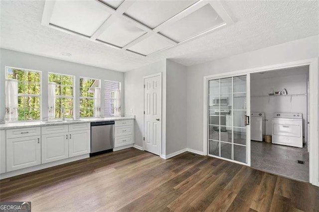3420 Honeysuckle Ln, Lithia Springs, GA 30122 - kitchen with dark wood-style floors, stainless steel dishwasher, light countertops, and a sink