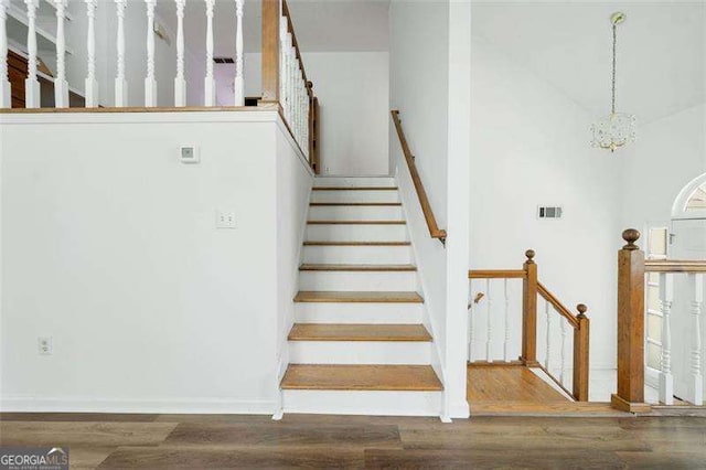 3420 Honeysuckle Ln, Lithia Springs, GA 30122 - stairway featuring visible vents, wood finished floors, and baseboards