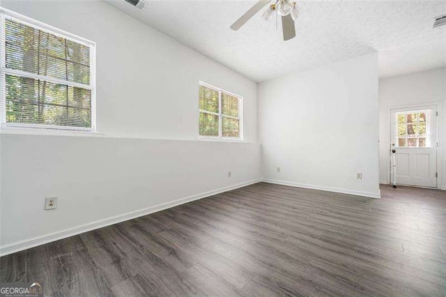 3420 Honeysuckle Ln, Lithia Springs, GA 30122 - unfurnished room with a ceiling fan, a wealth of natural light, and wood finished floors