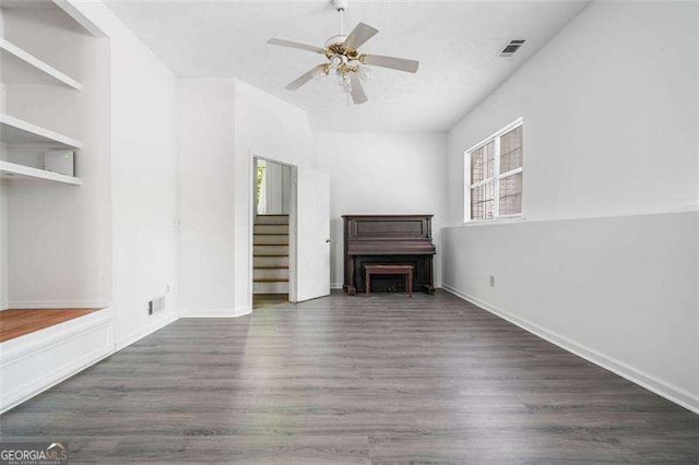 3420 Honeysuckle Ln, Lithia Springs, GA 30122 - unfurnished living room with baseboards, visible vents, wood finished floors, and a ceiling fan