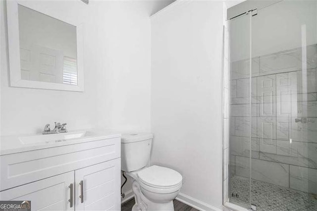 3420 Honeysuckle Ln, Lithia Springs, GA 30122 - full bathroom with vanity, toilet, a stall shower, and baseboards