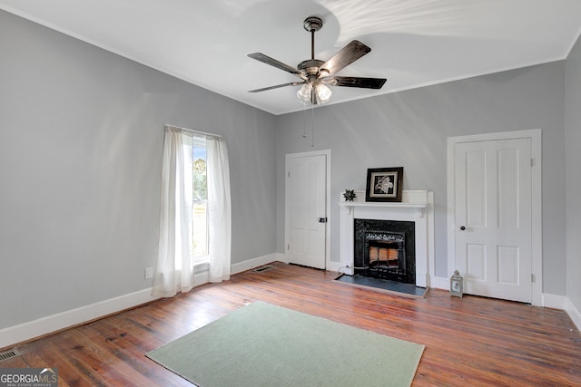 48 Roseview Dr, Concord, GA 30206 - unfurnished living room featuring a fireplace with flush hearth, ceiling fan, visible vents, baseboards, and wood finished floors
