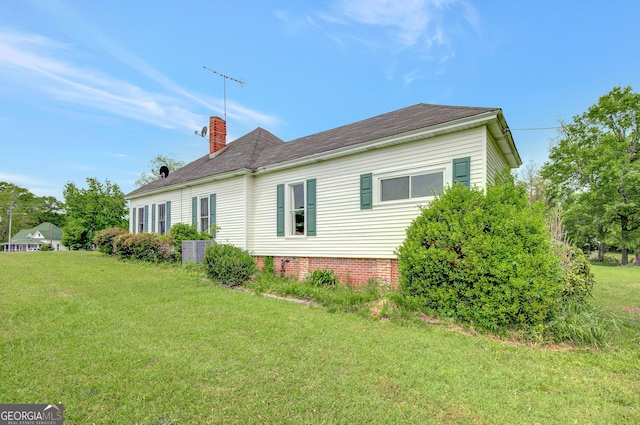 48 Roseview Dr, Concord, GA 30206 - view of property exterior featuring a chimney and a lawn