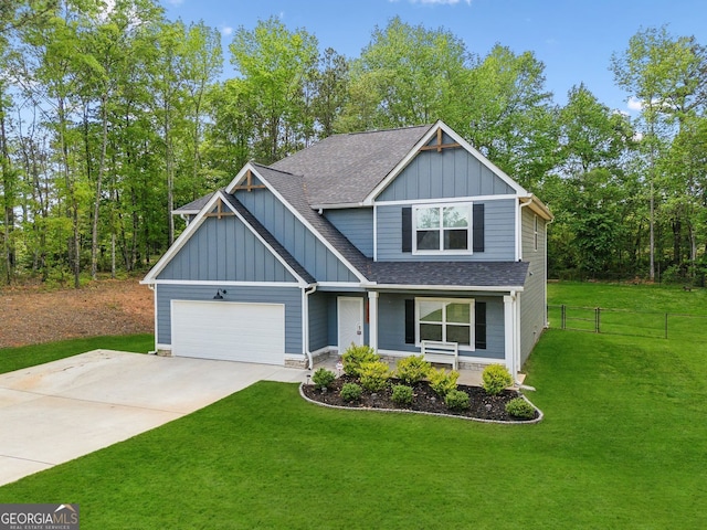 craftsman-style house with board and batten siding, covered porch, fence, a shingled roof, and a garage